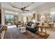 Spacious living area with access to the pool and lanai at 7504 Windy Hill Cv, Lakewood Ranch, FL 34202