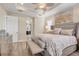 Luxurious main bedroom with a king-size bed and plenty of natural light at 7504 Windy Hill Cv, Lakewood Ranch, FL 34202