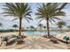Relaxing pool area with lounge chairs and palm trees at 7504 Windy Hill Cv, Lakewood Ranch, FL 34202