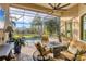 Relaxing screened-in pool area with patio furniture and fire pit at 7504 Windy Hill Cv, Lakewood Ranch, FL 34202