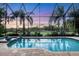 Enclosed pool and spa with stunning sunset view at 7504 Windy Hill Cv, Lakewood Ranch, FL 34202