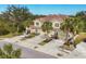 Aerial view of a three-unit building with attached garages and landscaping at 8150 Enclave Way # 104, Sarasota, FL 34243
