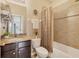 Clean bathroom with tiled shower and granite vanity at 8150 Enclave Way # 104, Sarasota, FL 34243