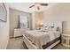 Bedroom with white dresser and palm tree bedding at 8150 Enclave Way # 104, Sarasota, FL 34243