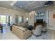 Relaxing community room with comfortable seating and a large TV at 8150 Enclave Way # 104, Sarasota, FL 34243