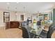 Kitchen with breakfast nook and glass dining table at 8150 Enclave Way # 104, Sarasota, FL 34243
