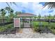 Dog park with rules and shaded seating areas at 8150 Enclave Way # 104, Sarasota, FL 34243
