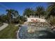 Community entrance with water feature and signage at 8150 Enclave Way # 104, Sarasota, FL 34243