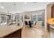 Kitchen with granite island, stainless steel appliances, and breakfast bar at 8150 Enclave Way # 104, Sarasota, FL 34243