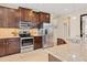Modern kitchen with stainless steel appliances and granite countertops at 8150 Enclave Way # 104, Sarasota, FL 34243