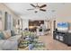 Open floor plan with modern furniture and kitchen island at 8150 Enclave Way # 104, Sarasota, FL 34243