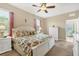 Main bedroom featuring a king bed, carpeted floor, and white dresser at 8150 Enclave Way # 104, Sarasota, FL 34243