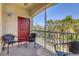 Private screened balcony offering outdoor seating and serene nature views at 8150 Enclave Way # 104, Sarasota, FL 34243