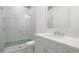 Bathroom with a glass shower, granite countertop, and single sink vanity at 8376 Sea Glass Ct, Sarasota, FL 34240