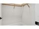 Walk-in closet with wood shelving providing ample storage at 8376 Sea Glass Ct, Sarasota, FL 34240