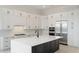 Well-appointed kitchen boasts modern appliances and a large island with seating at 8376 Seaglass Ct, Sarasota, FL 34240