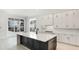 Bright kitchen with a stylish island, offering ample counter space and storage at 8376 Sea Glass Ct, Sarasota, FL 34240
