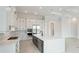 Modern kitchen design with white cabinets and a large island for food preparation at 8376 Sea Glass Ct, Sarasota, FL 34240