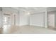 Spacious living room with light gray floors, white trim, and an open floor plan at 8376 Sea Glass Ct, Sarasota, FL 34240
