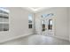 Bright living room featuring a double french door and transom window at 8376 Sea Glass Ct, Sarasota, FL 34240