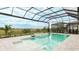 This screened-in pool and spa offer beautiful views of the green landscape under a partly cloudy blue sky at 8376 Sea Glass Ct, Sarasota, FL 34240