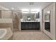 Double vanity bathroom with large shower and soaking tub at 8402 Grand Estuary Trl # 101, Bradenton, FL 34212