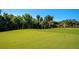 Putting green with several golf balls ready for a game at 8402 Grand Estuary Trl # 101, Bradenton, FL 34212