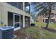 Ground level view of backyard with AC unit at 8889 White Sage Loop, Lakewood Ranch, FL 34202