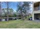 Backyard with pond and lush landscaping at 8889 White Sage Loop, Lakewood Ranch, FL 34202