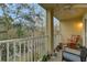 Relaxing screened balcony overlooks a tranquil pond and trees at 8889 White Sage Loop, Lakewood Ranch, FL 34202