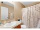 Cozy bathroom with a vanity, sink, and shower with a decorative curtain at 8889 White Sage Loop, Lakewood Ranch, FL 34202