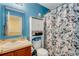 Bathroom with shower, sink, and white cabinet at 8889 White Sage Loop, Lakewood Ranch, FL 34202