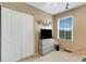 Bedroom with a window and closet at 8889 White Sage Loop, Lakewood Ranch, FL 34202