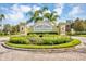A decorative and landscaped community sign reads Willowbrook in a circular roundabout at 8889 White Sage Loop, Lakewood Ranch, FL 34202