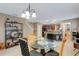 Dining area with seating for four and a view of the bar/kitchen area at 8889 White Sage Loop, Lakewood Ranch, FL 34202