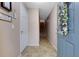 Bright and airy entryway with staircase at 8889 White Sage Loop, Lakewood Ranch, FL 34202