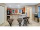 Modern kitchen features a breakfast bar and dark wood cabinetry at 8889 White Sage Loop, Lakewood Ranch, FL 34202