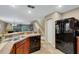 Kitchen with double sink, stainless steel appliances, and ample counter space at 8889 White Sage Loop, Lakewood Ranch, FL 34202