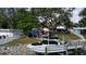 Waterfront property with boat lift, tiki bar, and pool at 1006 69Th W Ave, Bradenton, FL 34207