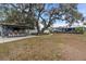 Outdoor Tiki bar and expansive grassy backyard at 1006 69Th W Ave, Bradenton, FL 34207