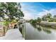 Serene canal views from a private dock with boat lift at 1006 69Th W Ave, Bradenton, FL 34207