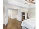 Main bedroom with hardwood floors, access to hallway and walk-in closet at 12213 Streambed Dr, Riverview, FL 33579