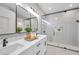 Modern bathroom with double vanity and frameless glass shower at 14146 Cattle Egret Pl, Bradenton, FL 34202