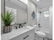 Modern bathroom with white subway tiles, marble vanity, and black accents at 14146 Cattle Egret Pl, Bradenton, FL 34202