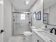 Clean bathroom, featuring a glass-enclosed shower and marble countertop at 14146 Cattle Egret Pl, Bradenton, FL 34202