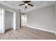 Spacious bedroom with light walls, wood flooring, and a large closet at 14146 Cattle Egret Pl, Bradenton, FL 34202