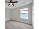 Bright bedroom with wood flooring and a window with blinds at 14146 Cattle Egret Pl, Bradenton, FL 34202