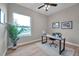 Home office with hardwood floors, large window, and workspace at 14146 Cattle Egret Pl, Bradenton, FL 34202