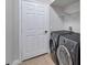 Convenient laundry room with washer, dryer, and shelving at 14146 Cattle Egret Pl, Bradenton, FL 34202