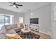 Spacious living room featuring a sectional sofa and large TV, perfect for relaxation at 14146 Cattle Egret Pl, Bradenton, FL 34202